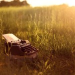 image of an old typewriter in a meadow