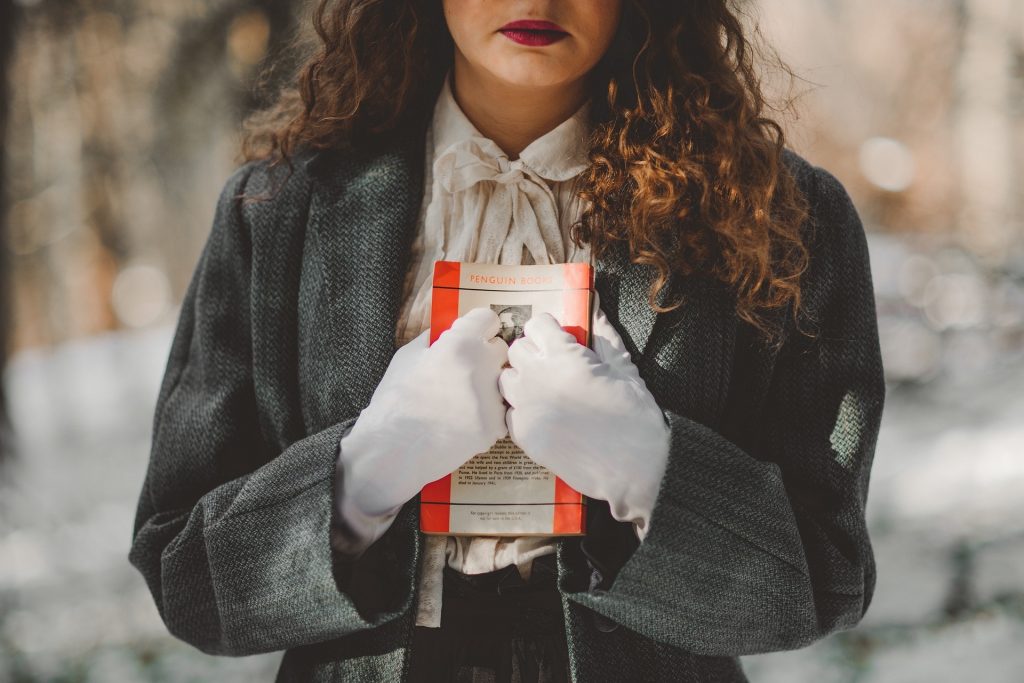 woman embracing book