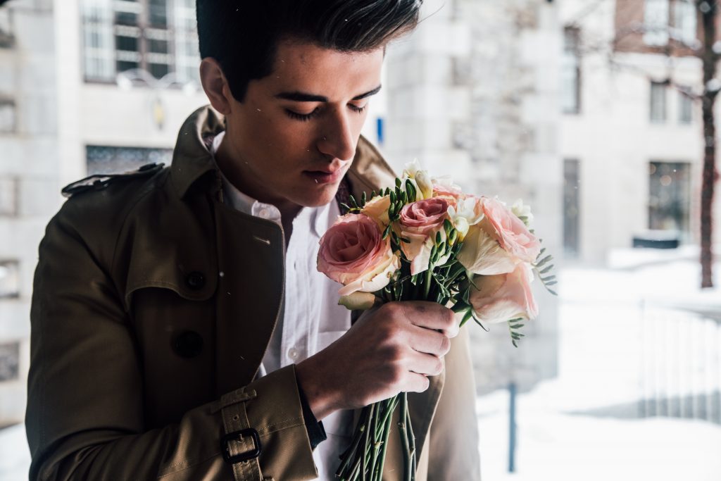 man with bouquet of flowers, romantic intentions